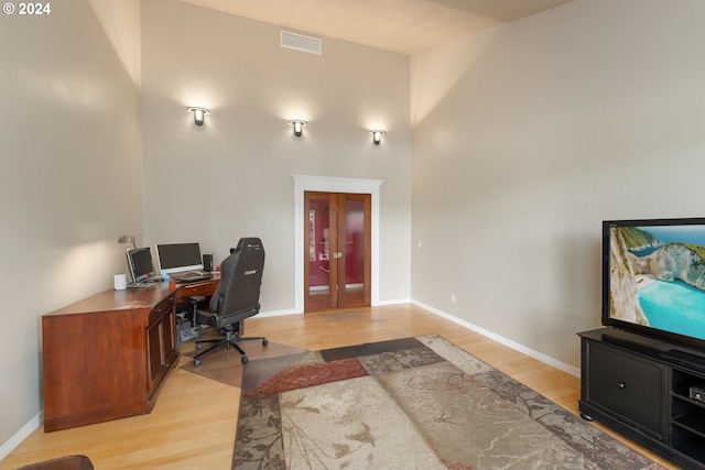 office area with french doors and light wood-type flooring