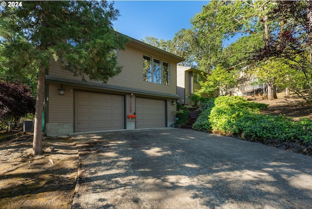 view of side of property with a garage