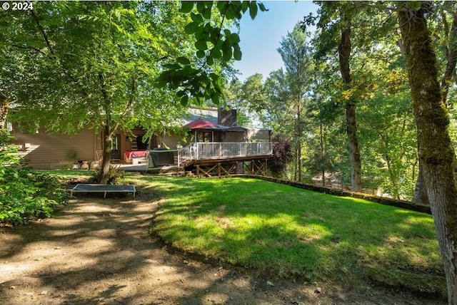 view of yard with a wooden deck