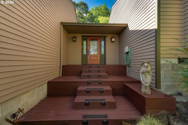 doorway to property featuring a deck