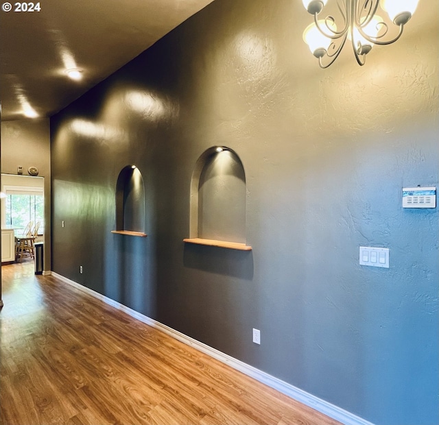 interior space featuring a notable chandelier and hardwood / wood-style floors