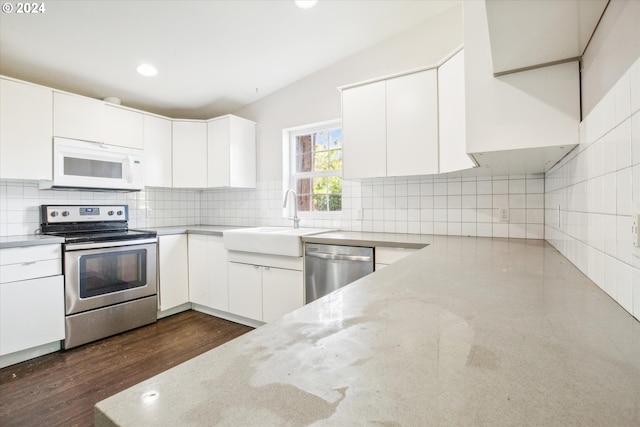 kitchen featuring dark wood-type flooring, white cabinetry, and appliances with stainless steel finishes