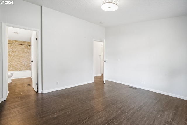 empty room featuring dark hardwood / wood-style floors