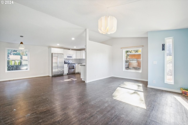 unfurnished living room featuring dark wood-type flooring, an inviting chandelier, and lofted ceiling