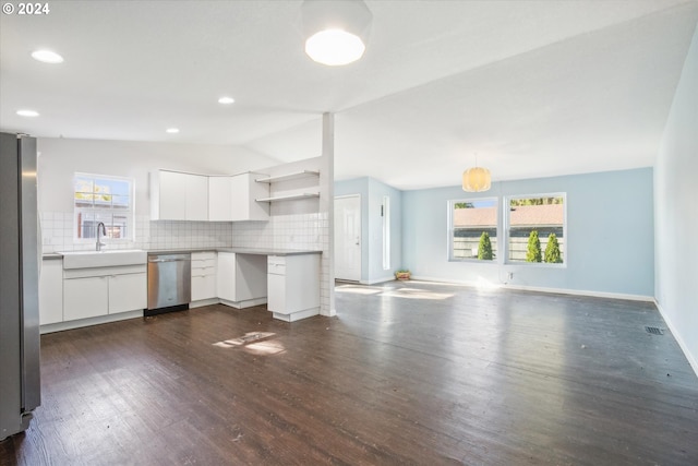 kitchen featuring white cabinets, lofted ceiling, stainless steel appliances, and dark hardwood / wood-style flooring