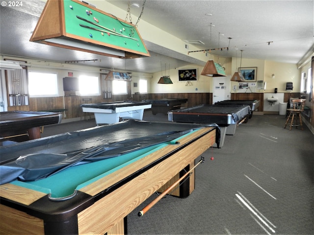 game room featuring carpet, a textured ceiling, and pool table