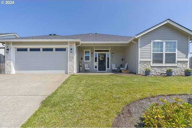 view of front of home featuring a garage and a front yard