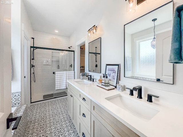 bathroom featuring vanity, an enclosed shower, and tile patterned flooring