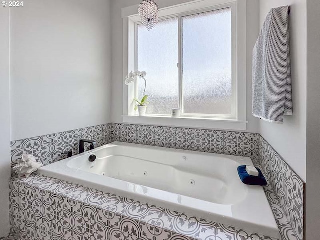 bathroom featuring a relaxing tiled tub