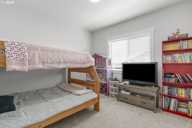 bedroom featuring light carpet