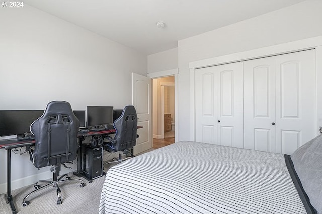 carpeted bedroom featuring a closet