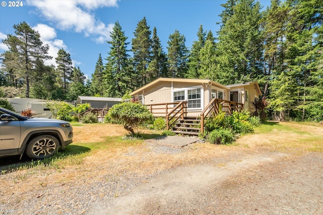 view of front of house with a deck