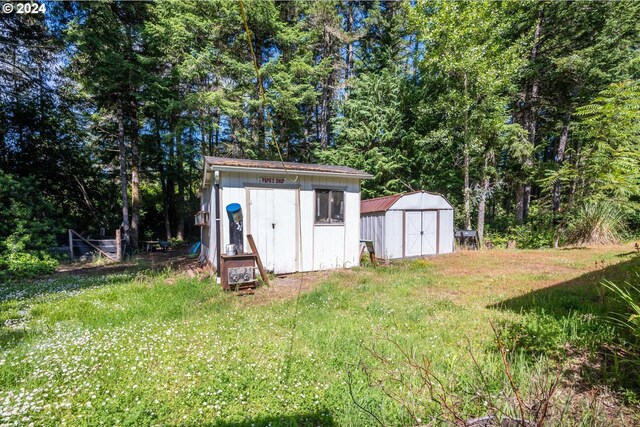 view of outbuilding with a lawn