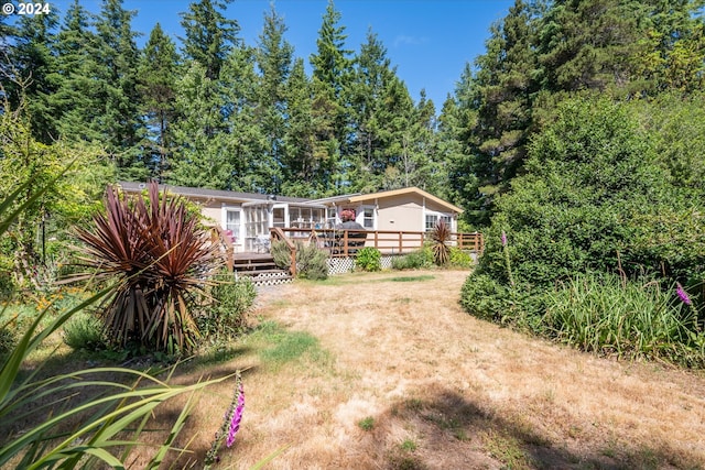 view of yard featuring a wooden deck