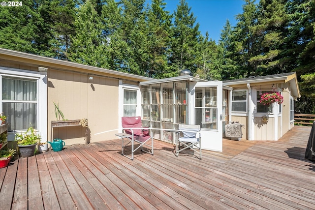 wooden terrace with a sunroom