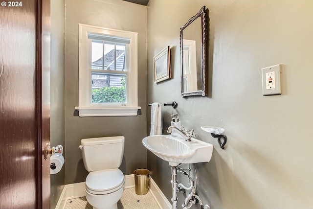 bathroom featuring tile patterned flooring and toilet