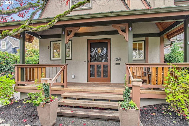 property entrance with covered porch