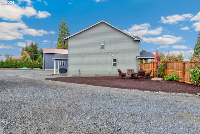 rear view of house featuring a patio