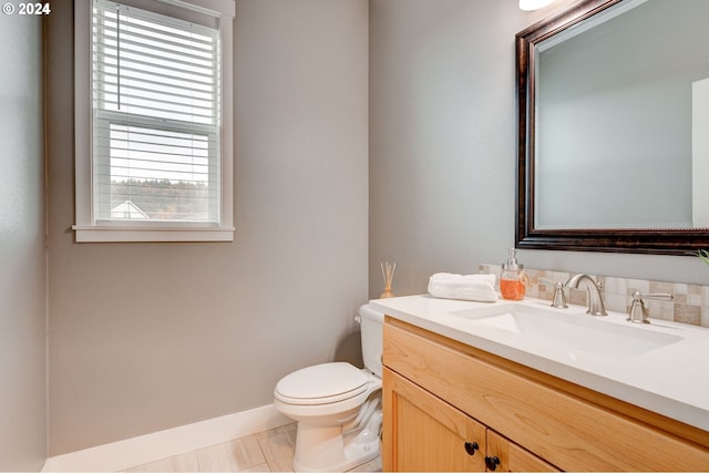 bathroom featuring toilet and vanity