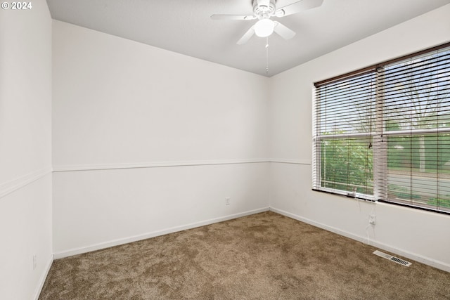 carpeted empty room with ceiling fan