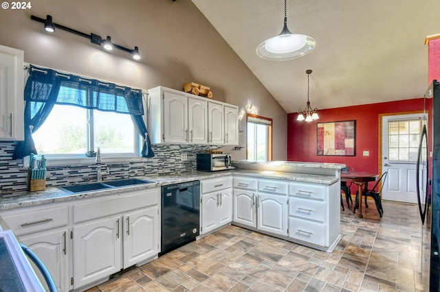 kitchen featuring white cabinets, dishwasher, kitchen peninsula, and hanging light fixtures