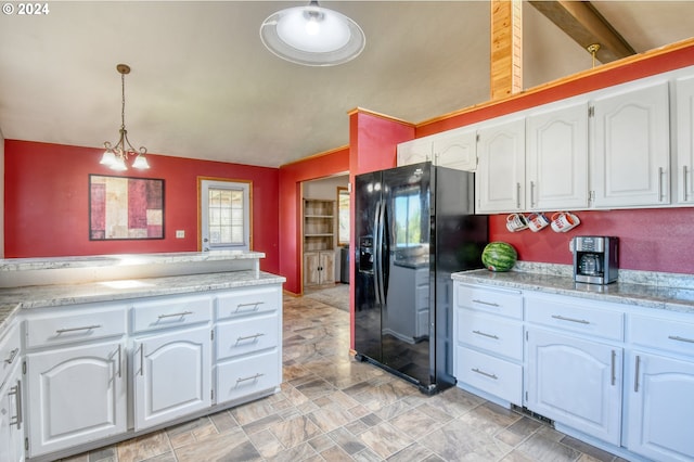 kitchen featuring black fridge with ice dispenser, white cabinetry, lofted ceiling with beams, and pendant lighting