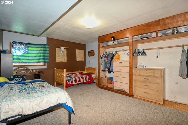 bedroom featuring a closet and light colored carpet