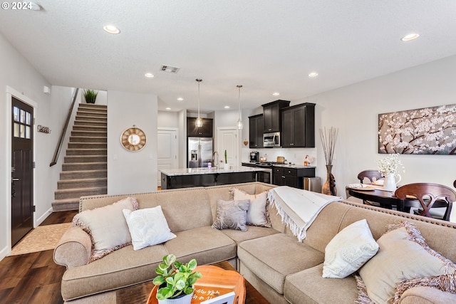 living room featuring dark wood-type flooring