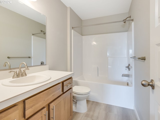 full bathroom with wood-type flooring, vanity, toilet, and shower / bath combination