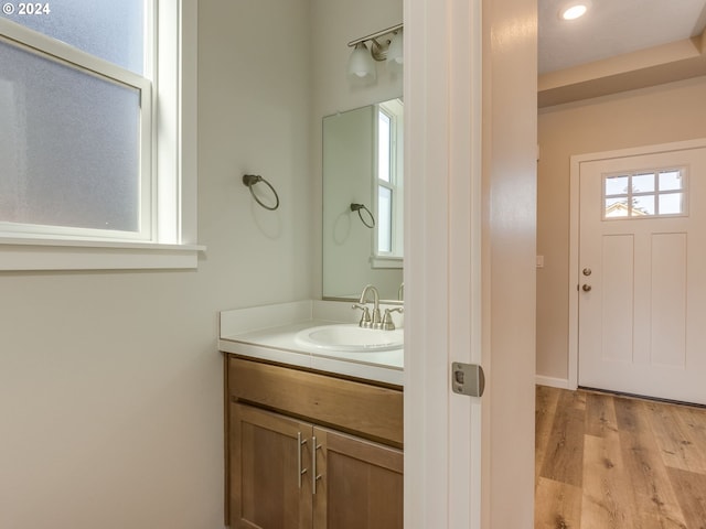 bathroom featuring vanity and hardwood / wood-style floors