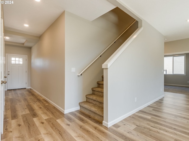 entrance foyer with plenty of natural light and light hardwood / wood-style floors