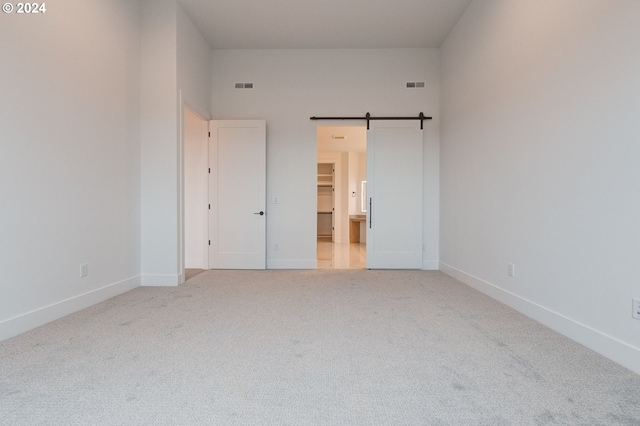 unfurnished bedroom with visible vents, carpet floors, and baseboards