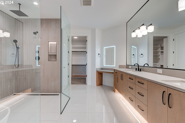 full bath with double vanity, walk in shower, visible vents, and a sink