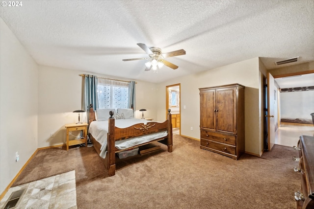 carpeted bedroom featuring ceiling fan, a textured ceiling, and connected bathroom