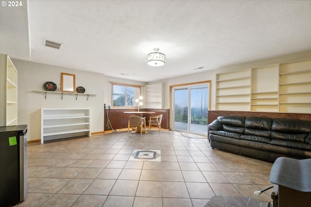 living room with light tile patterned floors