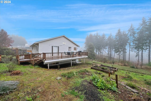 rear view of property with a deck