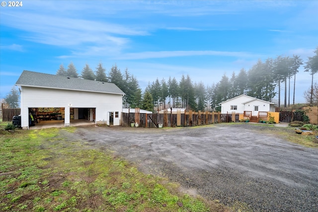 view of home's exterior featuring a wooden deck and a carport