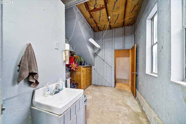 bathroom featuring sink and concrete floors