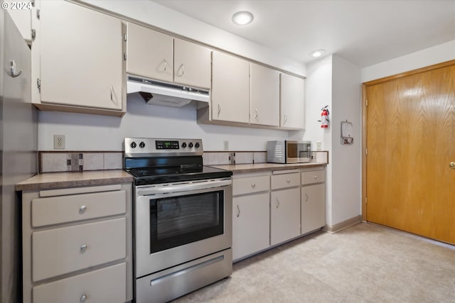 kitchen with white cabinetry and stainless steel electric stove