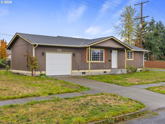 ranch-style home featuring a garage and a front yard