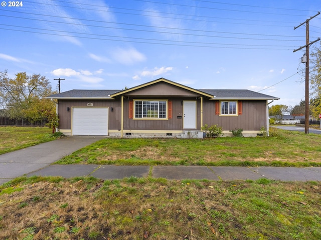 ranch-style house with a garage and a front lawn