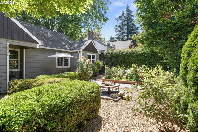 view of yard with a patio area and an outdoor fire pit