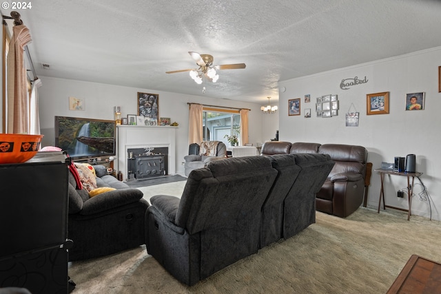 living room with carpet, a textured ceiling, crown molding, and ceiling fan with notable chandelier