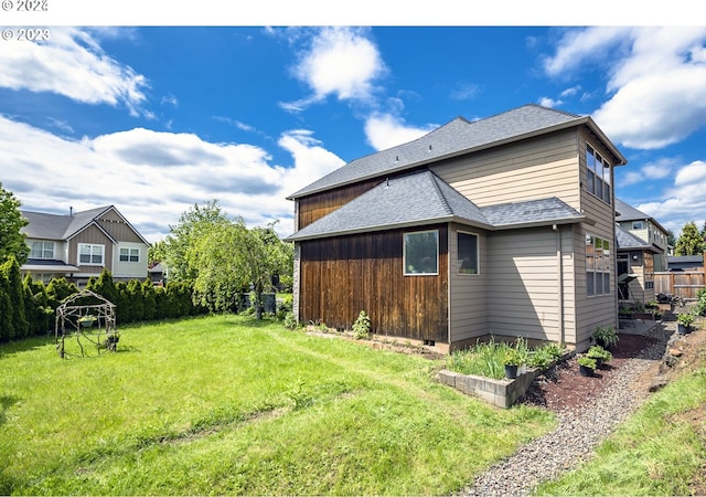 view of property exterior with a lawn