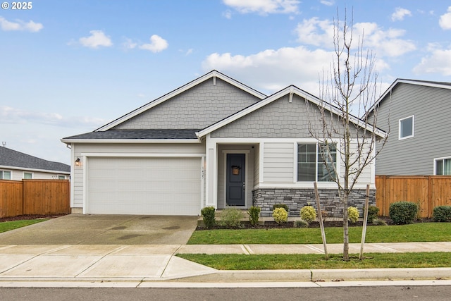 craftsman-style home with a garage and a front lawn