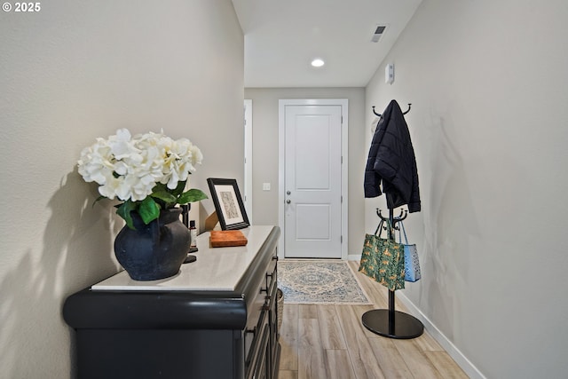 foyer entrance with light wood-type flooring