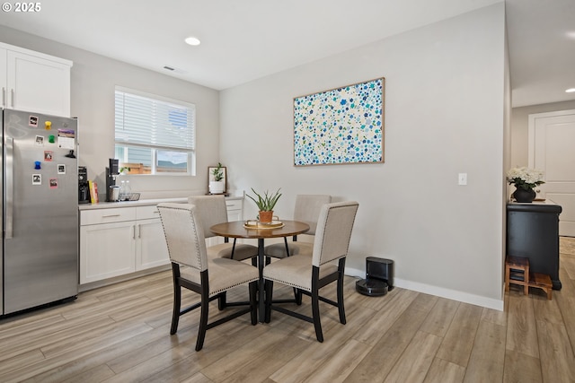 dining room with light wood-type flooring