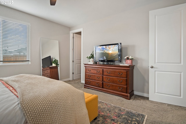 bedroom featuring ceiling fan and light colored carpet