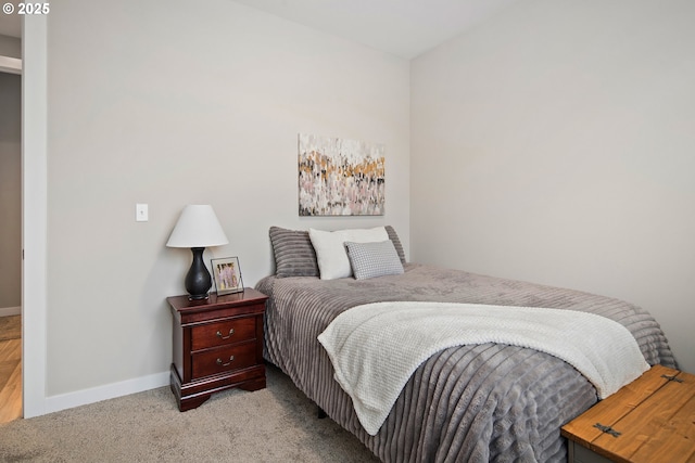 bedroom featuring light colored carpet