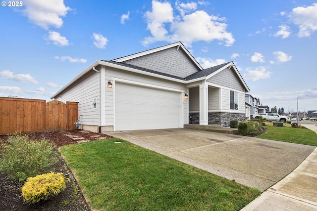 view of front of property with a garage and a front lawn